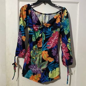 I’m selling a Colorful Tropical Romper and it’s a Medium.